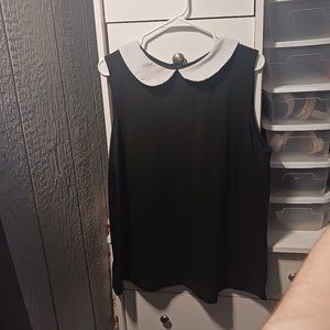 black sleeveless top with white peter pan collar